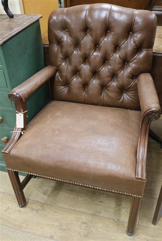 A leather button back elbow chair